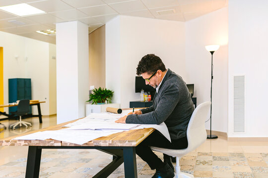 Mature male working on paper draft