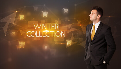 Businessman with shopping cart icons and WINTER COLLECTION inscription, online shopping concept