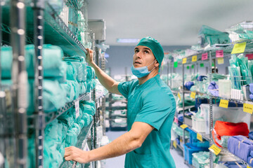 Nurse looking for medical equipment in the warehouse