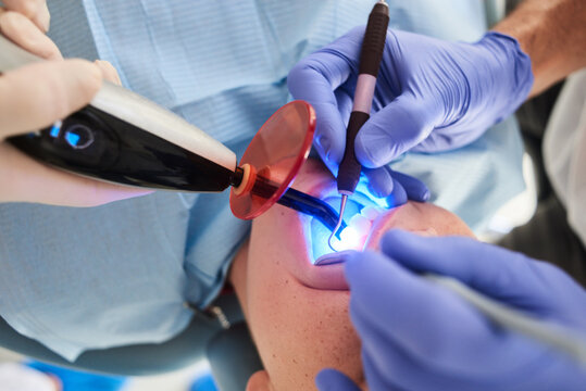 Dentist examining teeth of patient