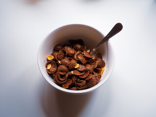 white recipe of chocolate cereals on a white table