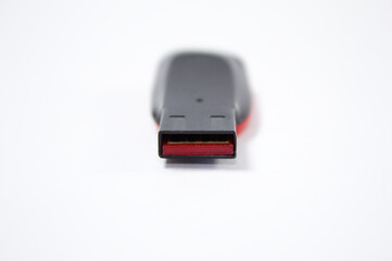 Flash drive with black and red colors and white background