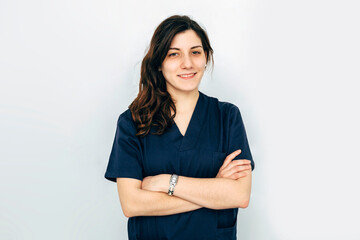 Portrait of happy biologist over white wall