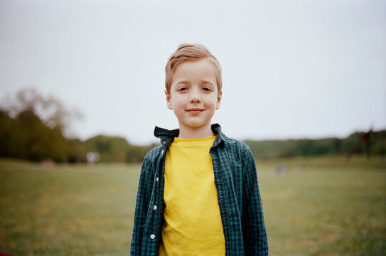 Handsome young boy standing outside