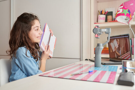 Girl recording video at home