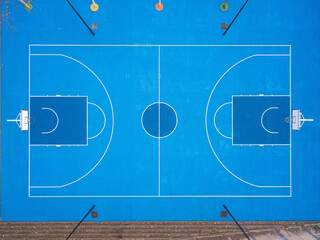 Blue colored basketball court with lines