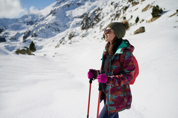 Happy girl hiking in winter