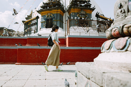 Woman near a small stupa in Kathmandu city