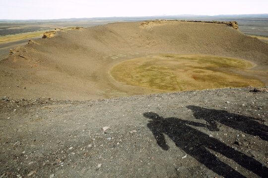 Two shadows on the ground in crater of Iceland