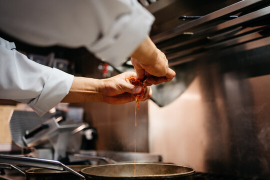 Anonymous chef cooking some italian dishes