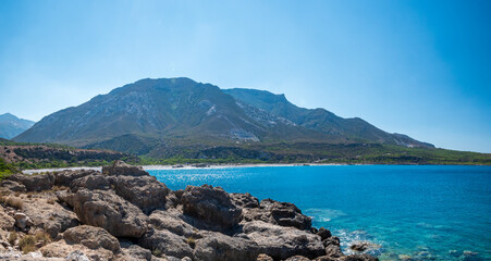 Fototapeta na wymiar Crete coast view with rocks and pure nature during a sunny summer day