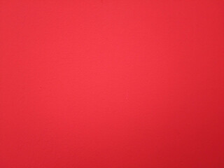 The red painted plaster of the walls has a rough concrete surface. For the image background texture