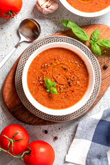 Gazpacho - Spanish cold tomato soup. Top view. Mediterranean cuisine, vegetarian and vegan food. Real homemade gazpacho made from tomatoes, peppers and cucumbers. 