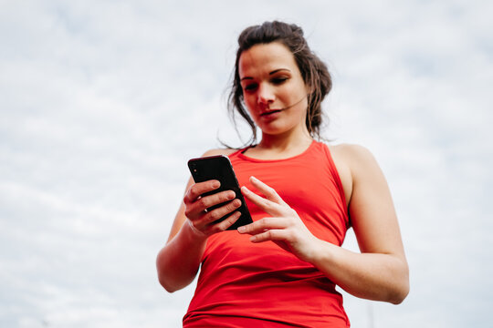 runner looking at her running results in an app