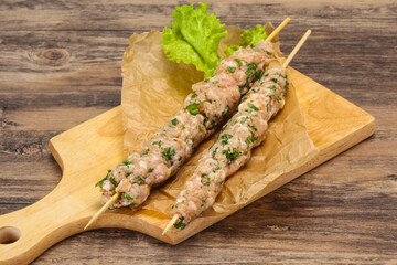 Raw minced pork skewer kebab for grill