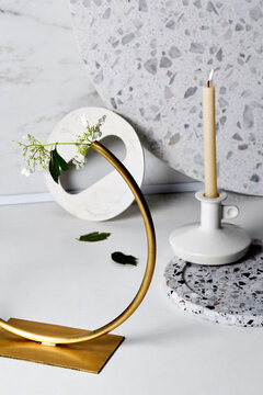 Candle stick with white marble and bronze flower circle.