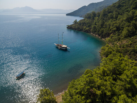 A few boat anchored in a peaceful cove