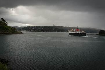 A ferry entering Oban Bay on a cloudy day, Scotland