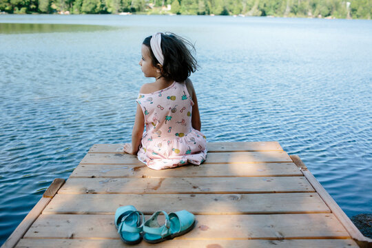 Kid on deck in the lake