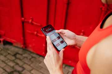 Anonymous runner looking at her running results in an app
