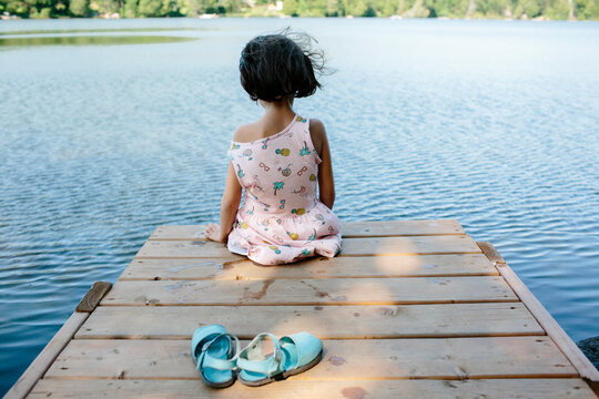 Kid on deck in the lake