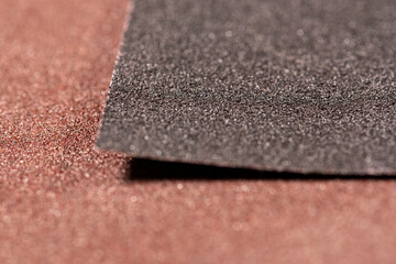 brown sandpaper for woodwork. Macro abrasive material - obrazy, fototapety, plakaty