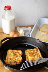 cooking french toast with iron skillet pan