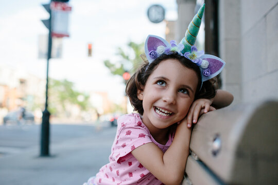 Kid with unicorn headband
