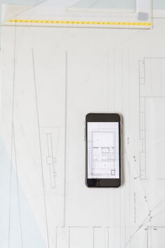 Phone and architect drawings