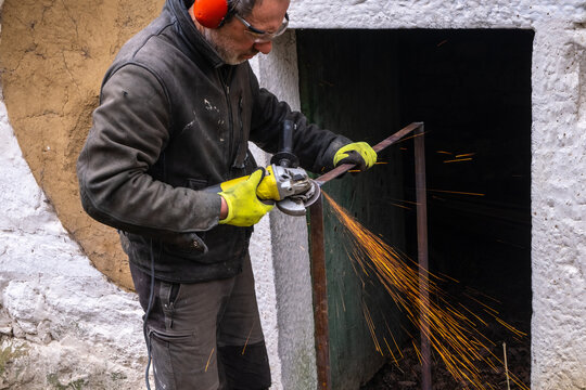 a man uses a grinder