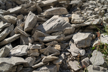 Close up of stones in highlands. Destroyed rock formations in mountainous area on sunny day