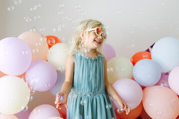 Happy girl with bubbles