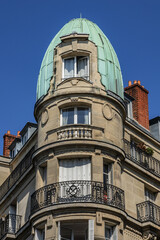 Fototapeta na wymiar The beautiful architecture of old apartment buildings on the Montmartre hill. Paris. France.