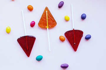 Delicious sweet candy on a stick. Lollipops on sticks in the form of berries