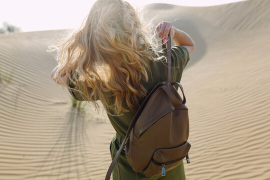 Woman with leather backpack