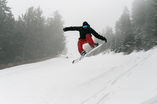 Man on the snowboard into the wild