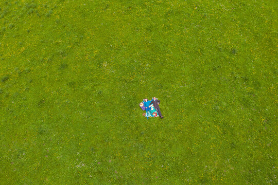 a couple is having a picnic on green grass