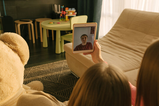 Woman having a videocall with her distant husband using a digital tablet