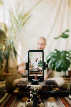 Tea master making video blog about tea ceremony at home