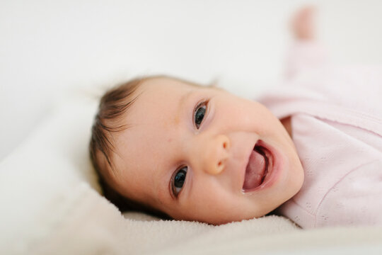 Baby born smiling at camera