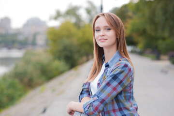 Portrait of a beautiful and happy girl outdoors