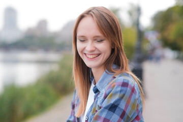 Portrait of a beautiful and happy girl outdoors