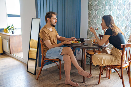 couple having lunch at a table in the kitchen