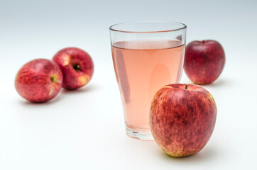 ripe apples and fresh juice in a glass