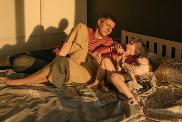 Happy family is in the bed