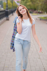 Portrait of a beautiful and happy girl outdoors