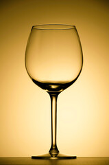 Wine glass on the illuminated background
