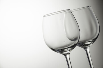 two wine glass on the illuminated background