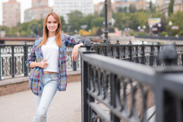 Portrait of a beautiful and happy girl outdoors