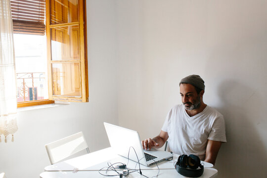 Man working on his computer at home